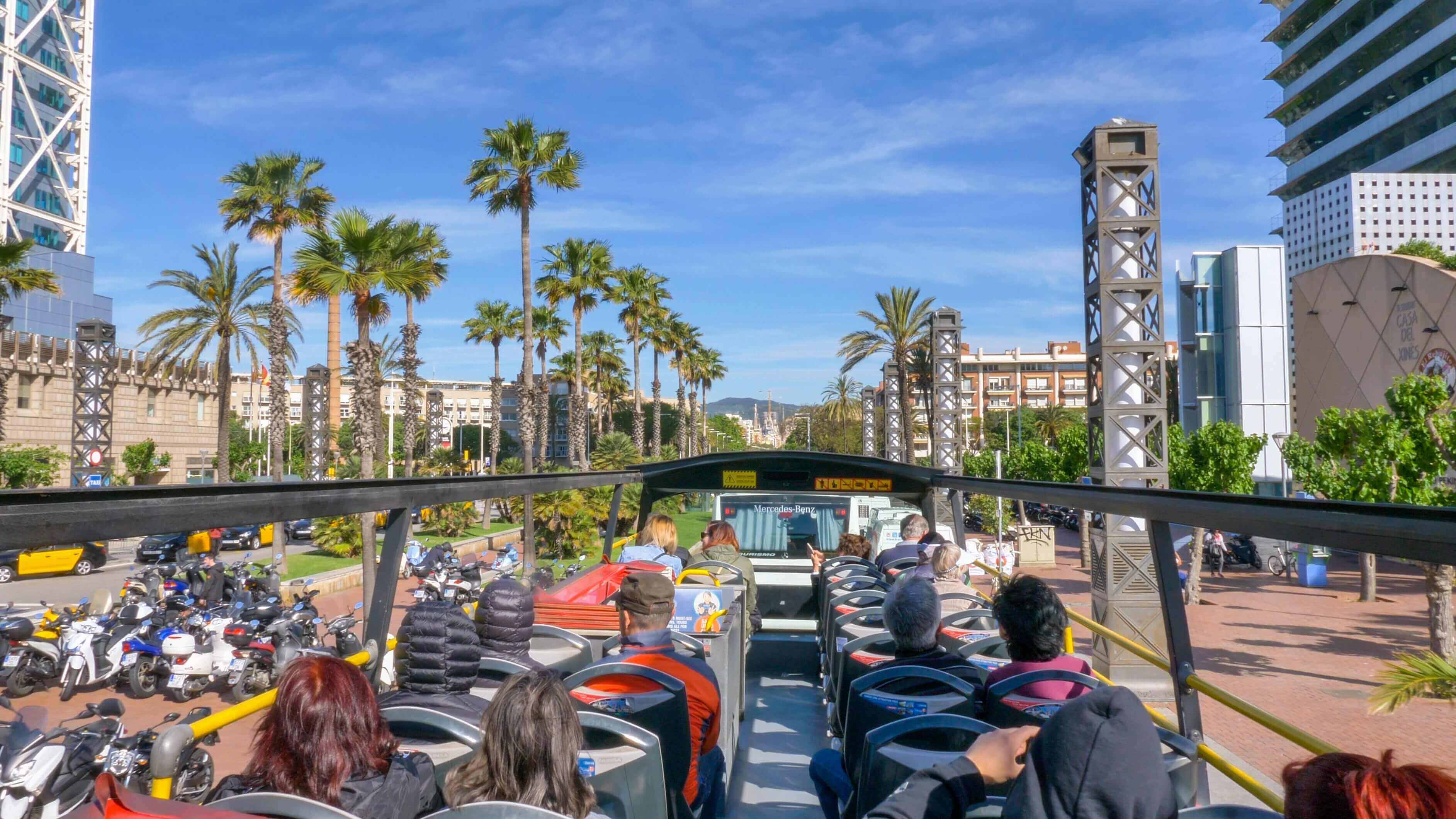 Onboard Barcelona city tour bus (Hop on/off) in the city streets. With three routes and a fleet of 74 buses, it offers a full coverage of the city's attractions.